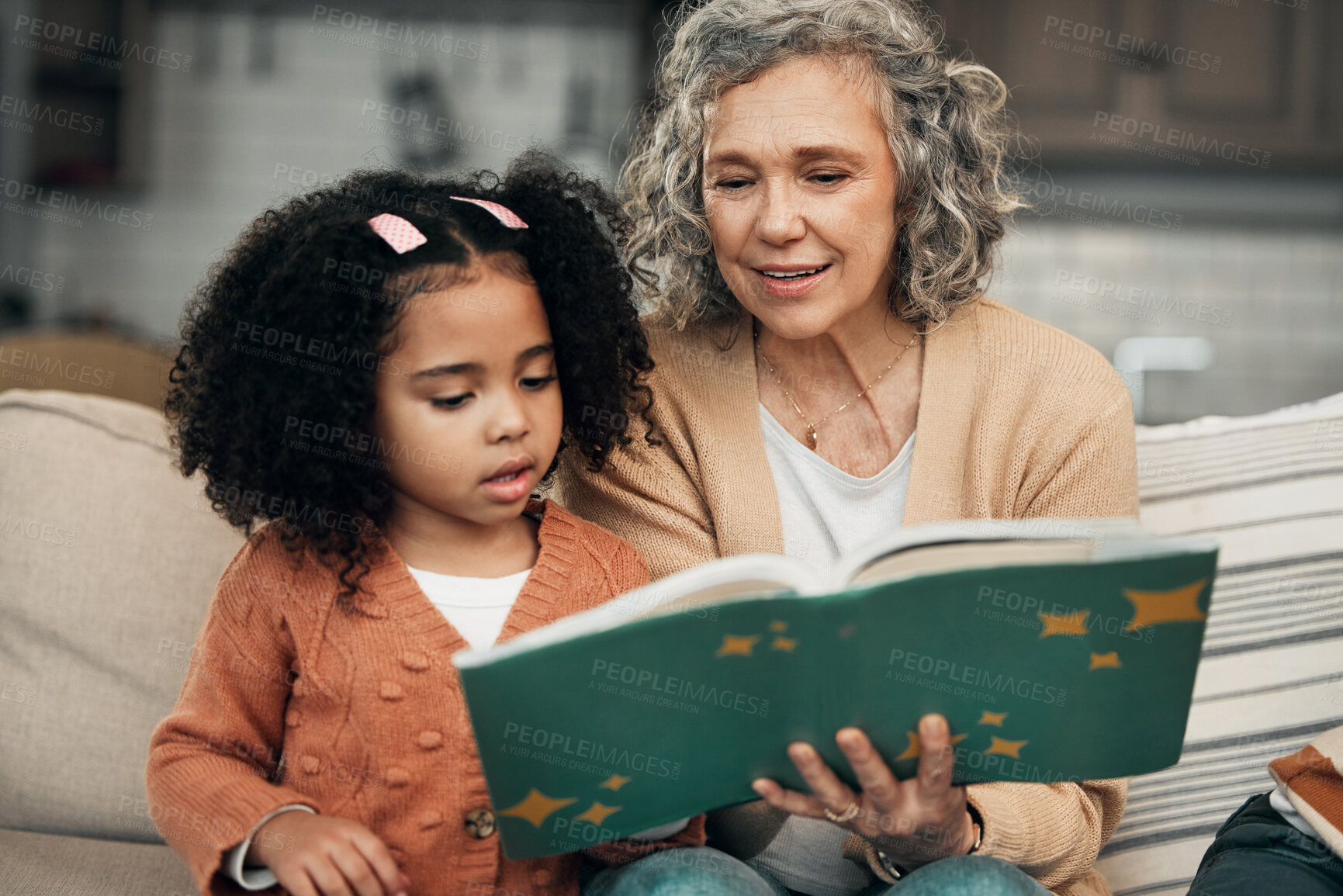 Buy stock photo Adoption child, book and grandmother reading fantasy storybook, story or bonding on home living room sofa. Family love, grandma and senior woman with youth development for learning kindergarten girl