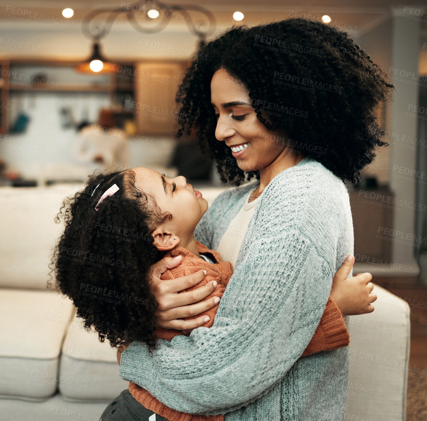 Buy stock photo Family, love and child hug mom for Mothers Day, home bonding or embrace in house living room. Care, loving and happy mother or woman smile with female youth kid, girl or daughter in apartment