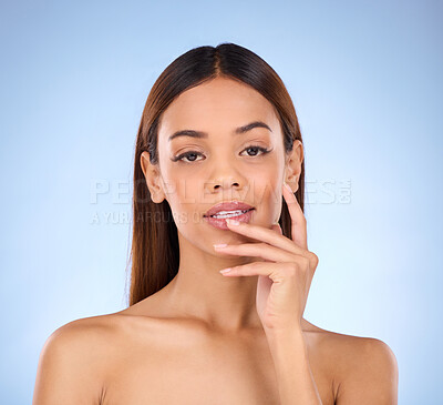 Buy stock photo Skincare, dermatology and portrait of woman beauty with smooth clear skin due to facial isolated in a studio blue background. Soft, natural and clean model due to self care as cosmetic treatment