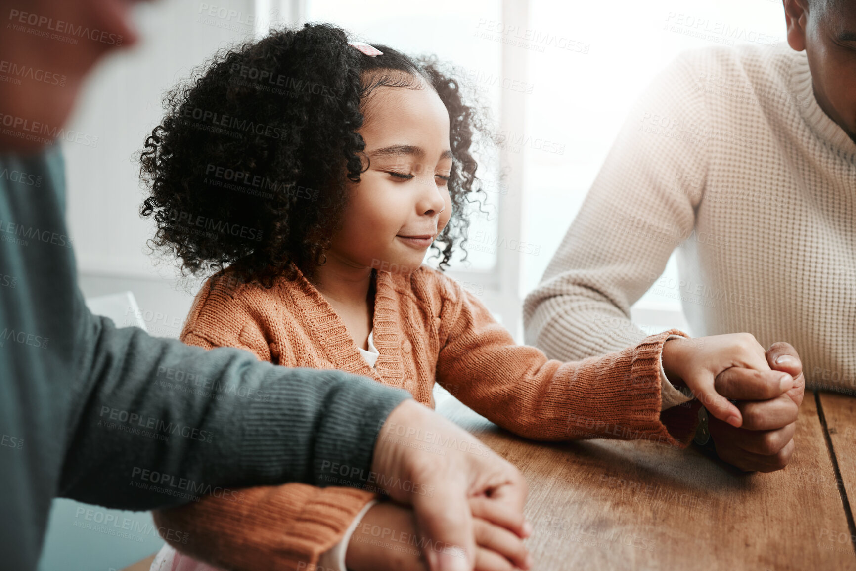 Buy stock photo Worship, girl and family holding hands, praying and spiritual practice in home, peace and quality time. Female child, believers and group with support, holy and bonding with joy, guidance and praise