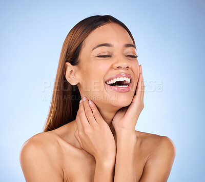 Buy stock photo Skincare, makeup and woman laughing with hands on face in studio for skin care promo on blue background. Beauty, facial and cosmetics, hispanic model with smile in Brazil for happy dermatology promo.