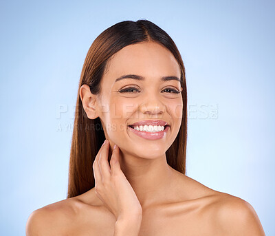 Buy stock photo Portrait, smile and woman with dermatology, cosmetics and grooming against blue studio background. Face, lady and female with happiness, natural and salon treatment for morning routine and soft skin