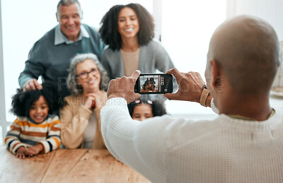 Buy stock photo Love, smile or phone photography with happy family in living room for social media, bonding or relaxing. Happiness, pictures or generations with grandparents or children at home for memory or support
