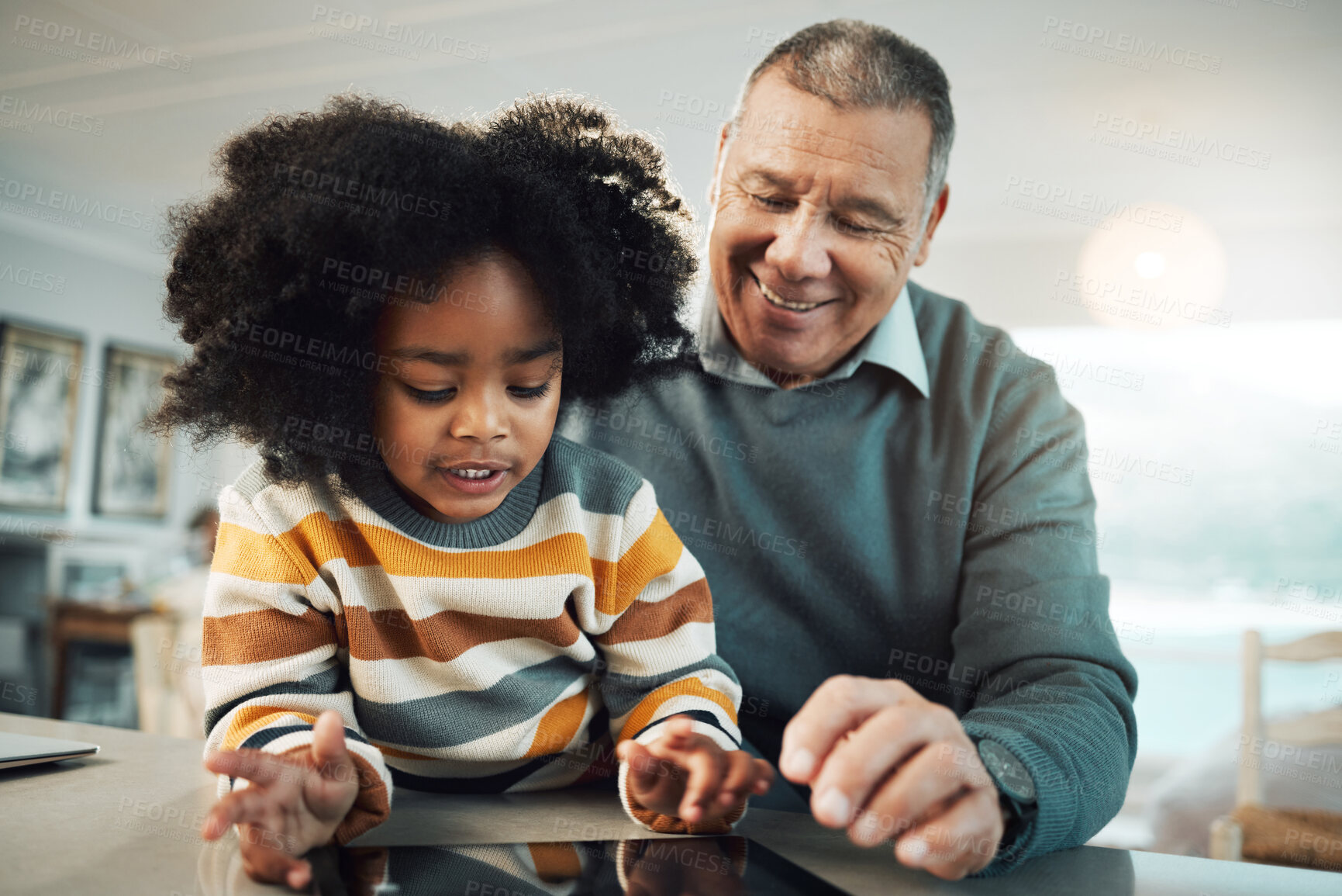 Buy stock photo Education, home school and grandfather helping child with reading for an assignment or project. Learning, bonding and elderly man teaching boy kid grandchild with homework in the living room at home.