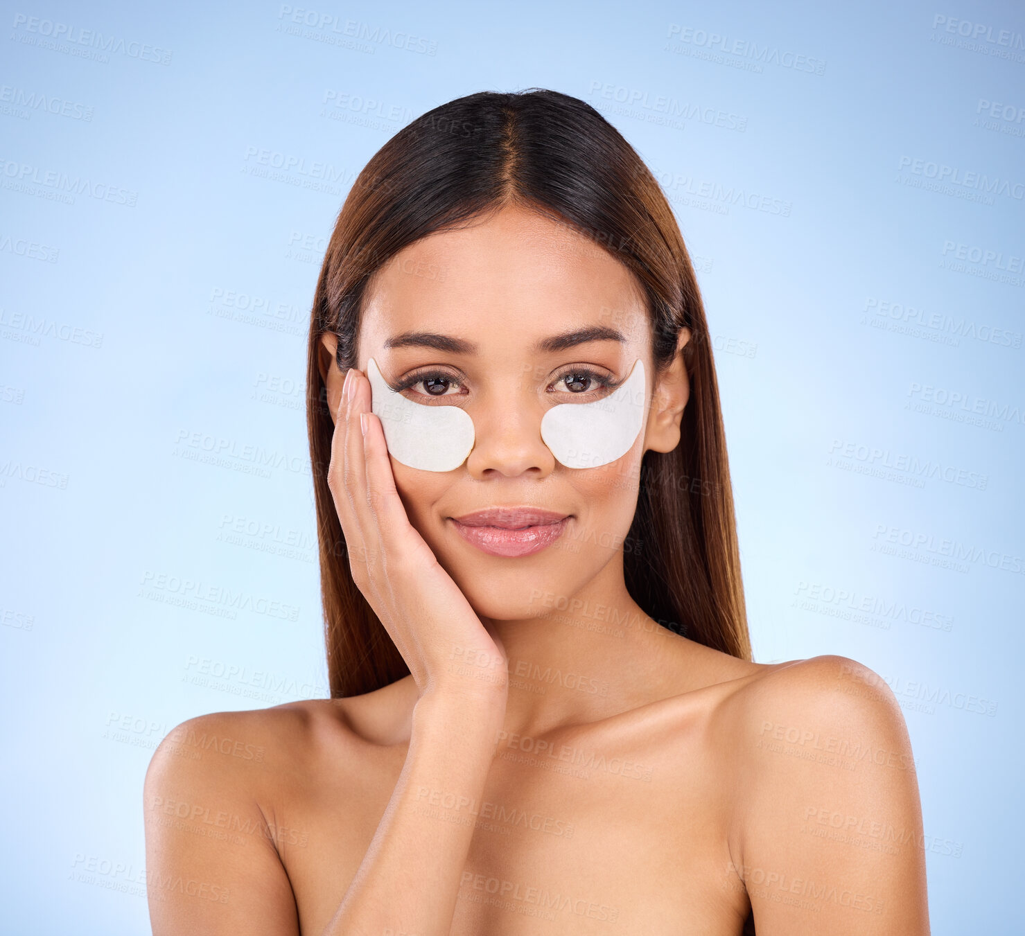 Buy stock photo Skincare, eyes and portrait of woman with collagen eye mask for anti aging skin on blue background. Cosmetics, facial repair and face of beauty model with wrinkle treatment product in studio.