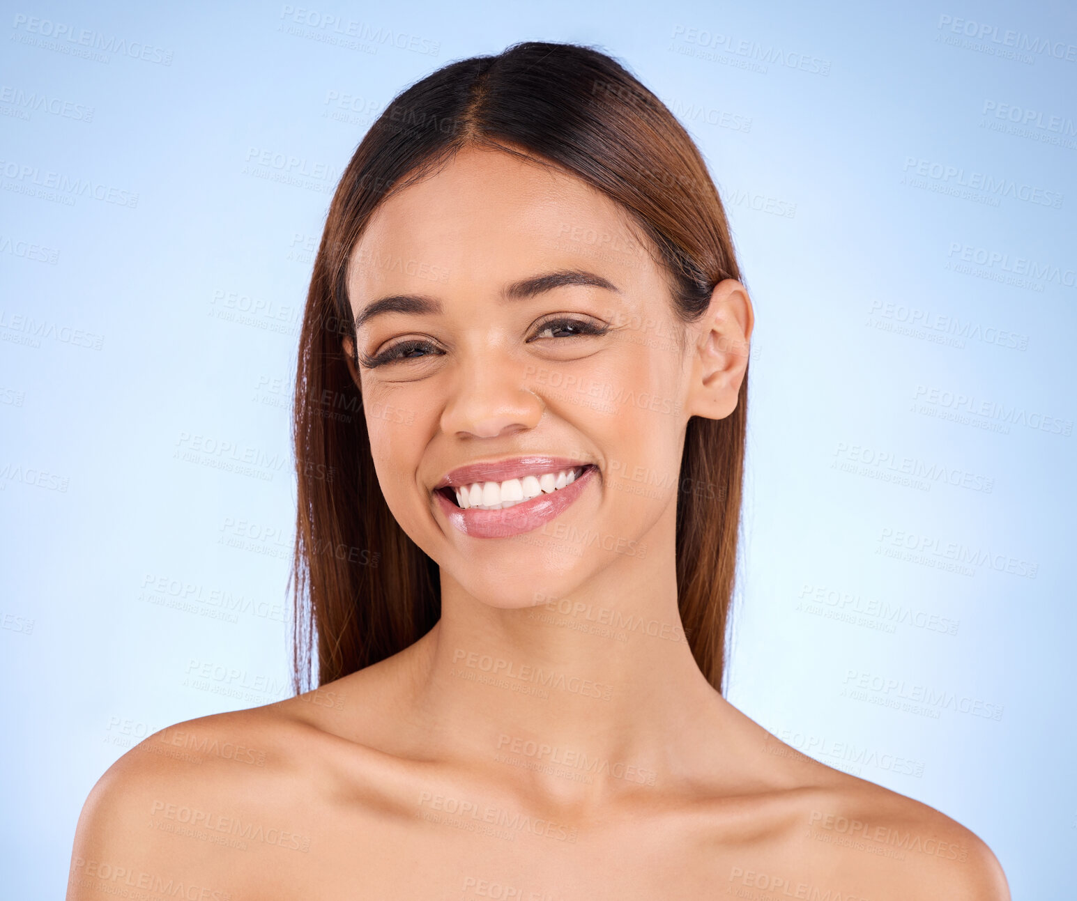Buy stock photo Skincare, beauty and smile, portrait of woman in studio for glowing skin or natural spa makeup on blue background. Cosmetics, facial and dermatology, face of happy hispanic model in studio mockup.