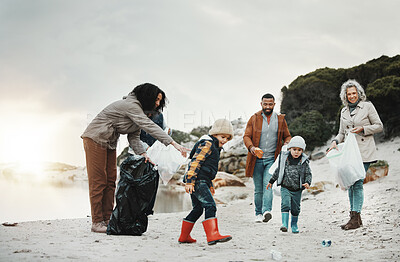 Buy stock photo Beach cleaning, trash and children, family or volunteering group in education, learning and community support. Grandparents, people and kids helping with plastic waste or garbage for pollution action