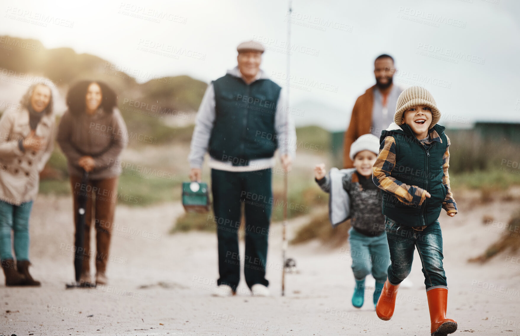 Buy stock photo Running, happy and family at the beach for fishing, hobby and weekend activity. Carefree, freedom and children, parents and grandparents playing by the ocean and ready to catch fish for recreation