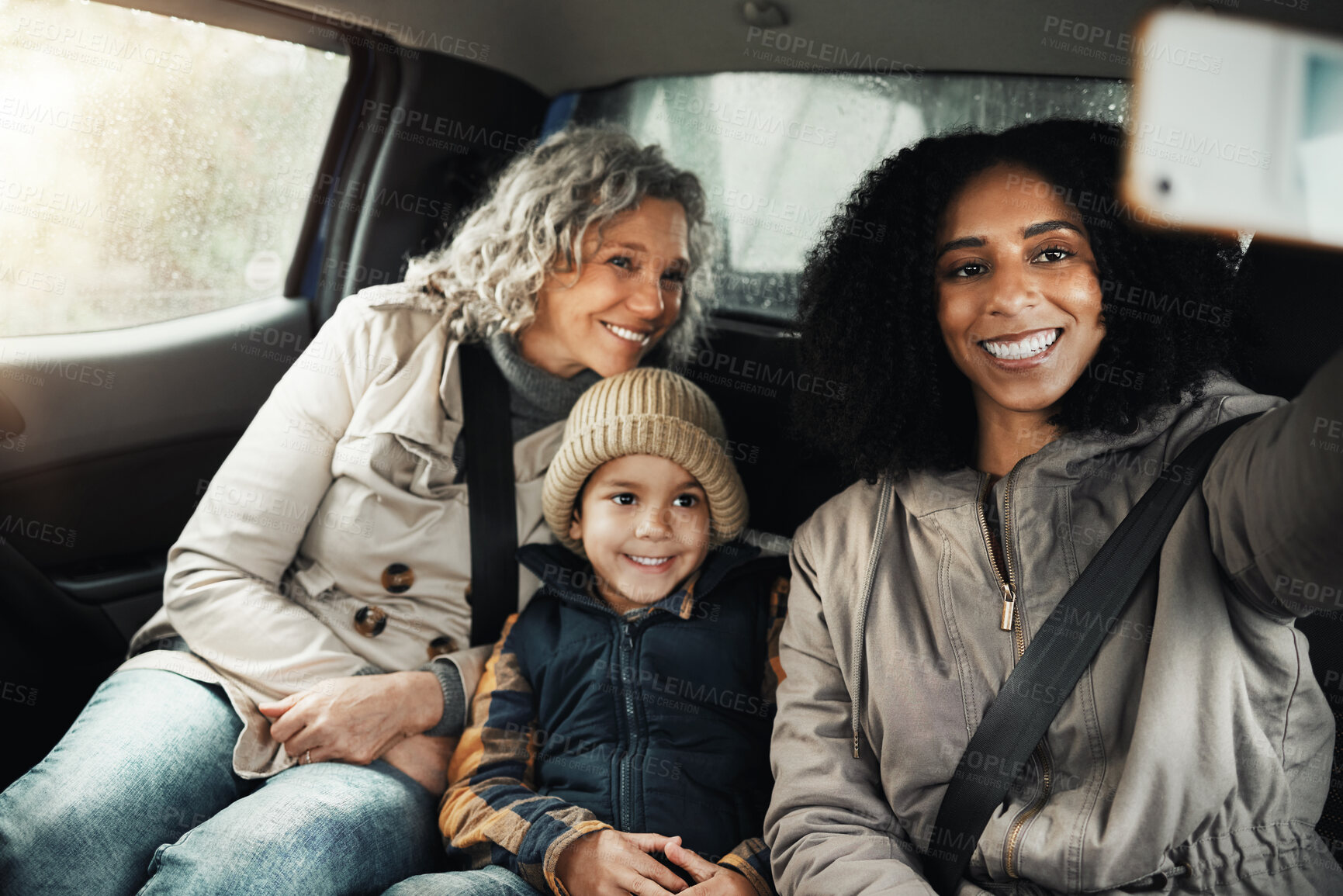Buy stock photo Selfie, smile and family on a road trip in a car for bonding, quality time and a getaway together. Happy, travel and mother, grandmother and a child taking a photo on vacation for social media