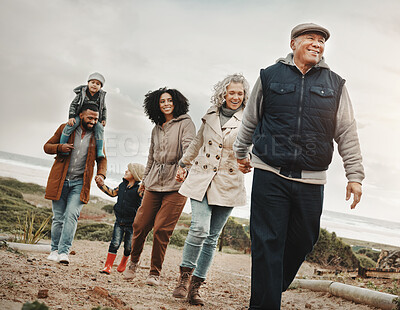 Buy stock photo Family holding hands, hiking outdoor together in nature and happiness, bonding and spending quality time. Grandparents, parents and children walking, love and care with happy people and generations