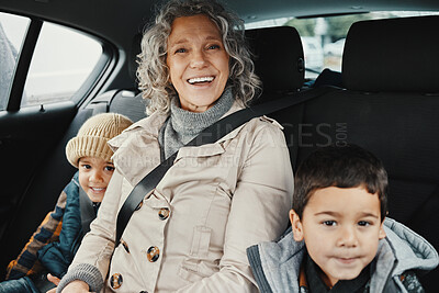 Buy stock photo Portrait, road trip and grandmother travel with children or grandchildren and relax on a car ride in the backseat. Bonding, happy and grandma traveling with kids or grandkids on a journey