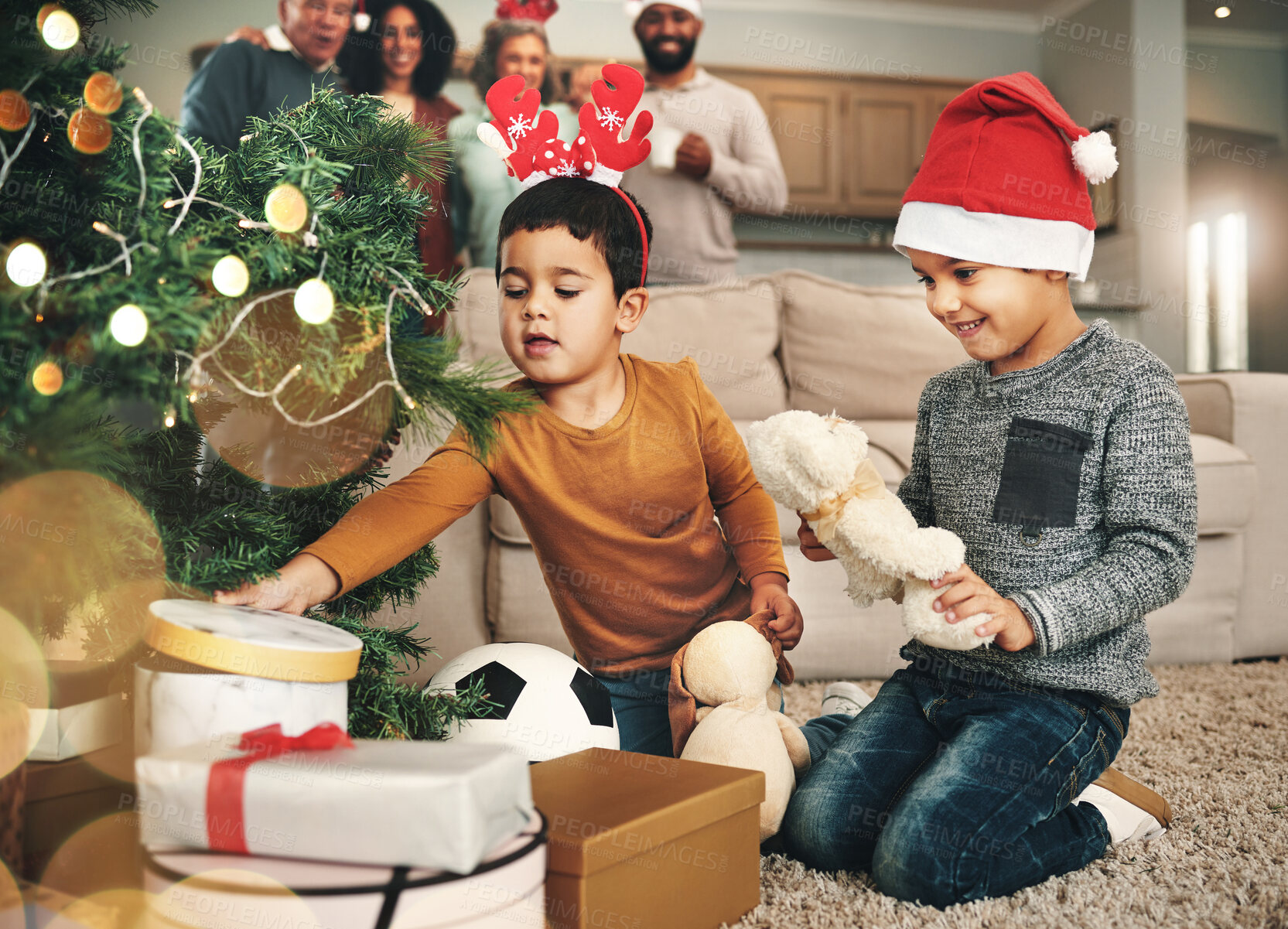 Buy stock photo Christmas, happy and children opening gifts, looking at presents and boxes together. Smile, festive and kids ready to open a gift, or present under the tree for celebration of a holiday at home