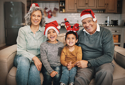 Christmas, photo album or memories with a grandmother and kids looking at  photographs during festiv Stock Photo by YuriArcursPeopleimages