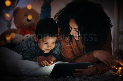 Buy stock photo Movie, dark and a mother and child with a tablet before bedtime for a show, video or meme. Happy, streaming and a mom and boy kid watching a film, cartoon or series online with technology at night