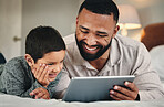 Dad, son and bed with tablet for bonding, love and streaming movies on web app with happiness. Man, kid and bedroom in family home with mobile touchscreen ux for gaming, e learning and relax together