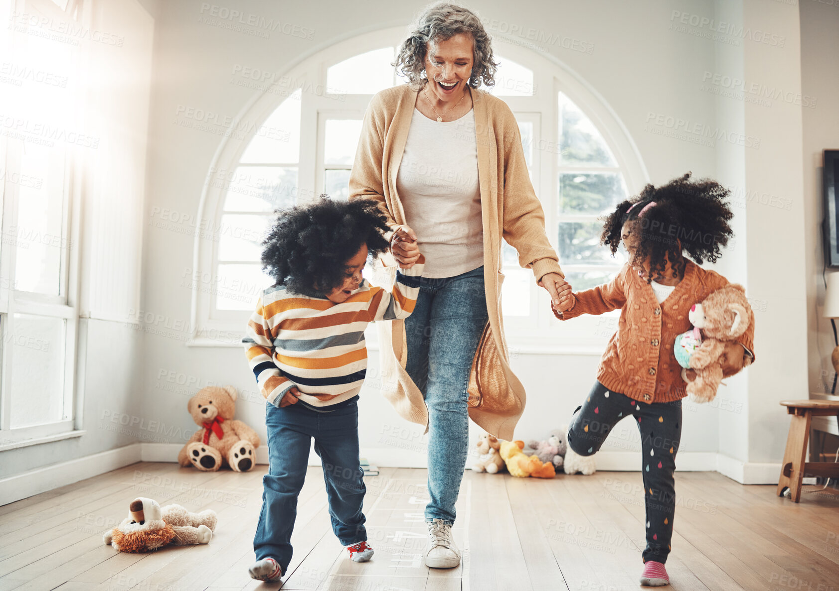 Buy stock photo Hopscotch, happy and children play with grandmother in home having fun, enjoy games and relax together. Happy family, childhood and kids with grandma for jumping game, balance and numbers activity