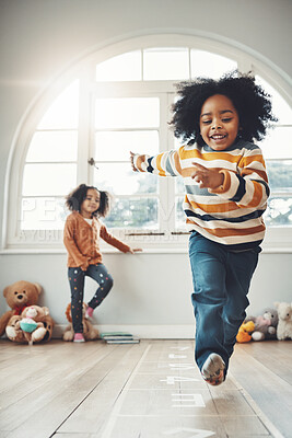 Buy stock photo Hopscotch, happy and children play in home having fun, enjoy games and relax together in room. Childhood, entertainment and excited siblings in bedroom for jumping game, playing and activity