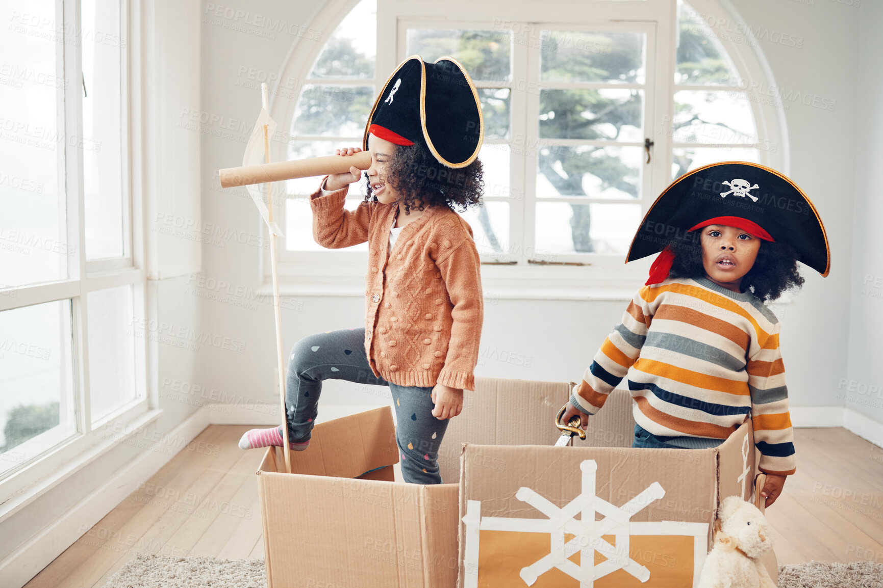 Buy stock photo Pirate, box and games with children in living room for playful, creative and imagine. Fantasy, relax and party with kids sailing in cardboard boat at home for free time, weekend and entertainment