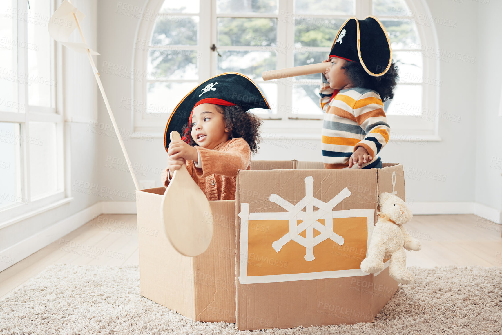 Buy stock photo Playing, box boat and pirate children role play, fantasy imagine or pretend in cardboard container. Telescope, fun home game or sailing black kids on Halloween cruise adventure with yacht captain