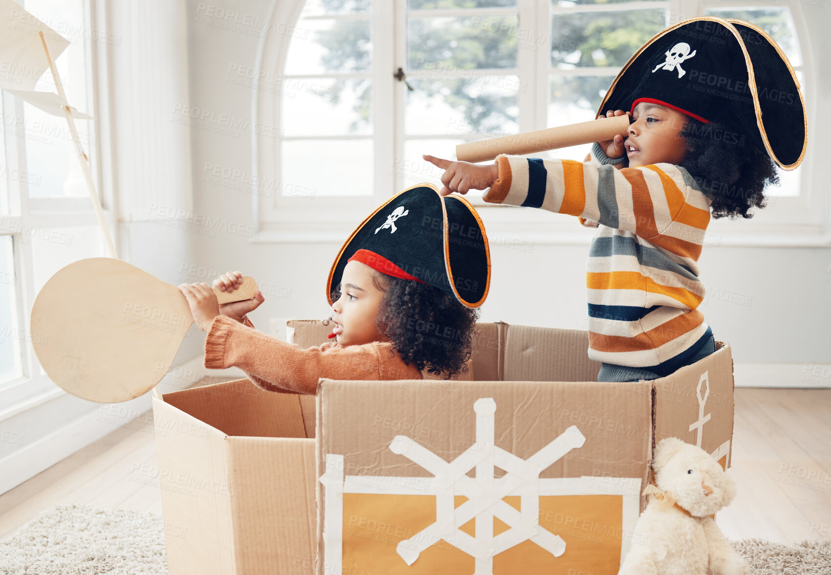 Buy stock photo Pirate, box and playing with children in living room for bonding, imagine and creative. Happy, youth and siblings with girls sailing in cardboard ship in family home for relax, fantasy and games