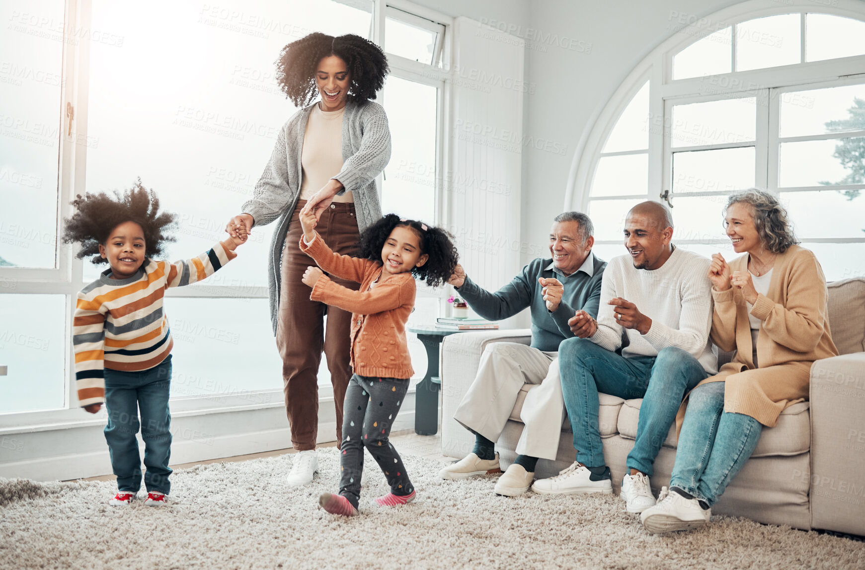 Buy stock photo Black family, vacation and mother playing with children in a home in winter and bonding together in a house. Parents, grandparents and mom play with kid having fun in a living room on a getaway