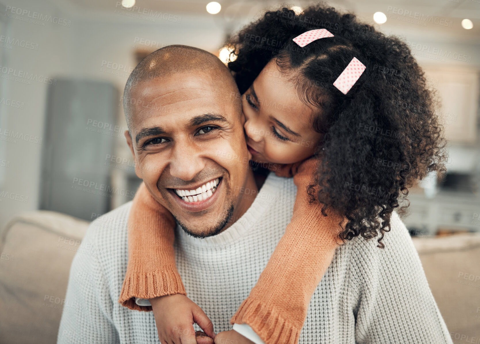 Buy stock photo Happy family, portrait and girl kissing father on sofa, hug and smile, laugh and bond in their home. Piggyback, face and child with parent on couch, fun and embracing in living room on the weekend