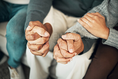 Buy stock photo Support, love and family holding hands on sofa for comforting embrace, prayer and trust together at home. Motivation, empathy and connected parents and adult children for care, compassion and praying