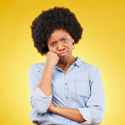 Buy stock photo Black woman, sad face and portrait in studio upset, sulking and disappointed on a yellow background. African female model with fatigue, problem or mental health with afro hair and color space