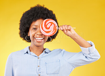 Buy stock photo Cover, candy and lollipop with black woman in studio for colorful, cheerful and positive. Young, happiness and dessert with female isolated on yellow background for treats, food and confectionary