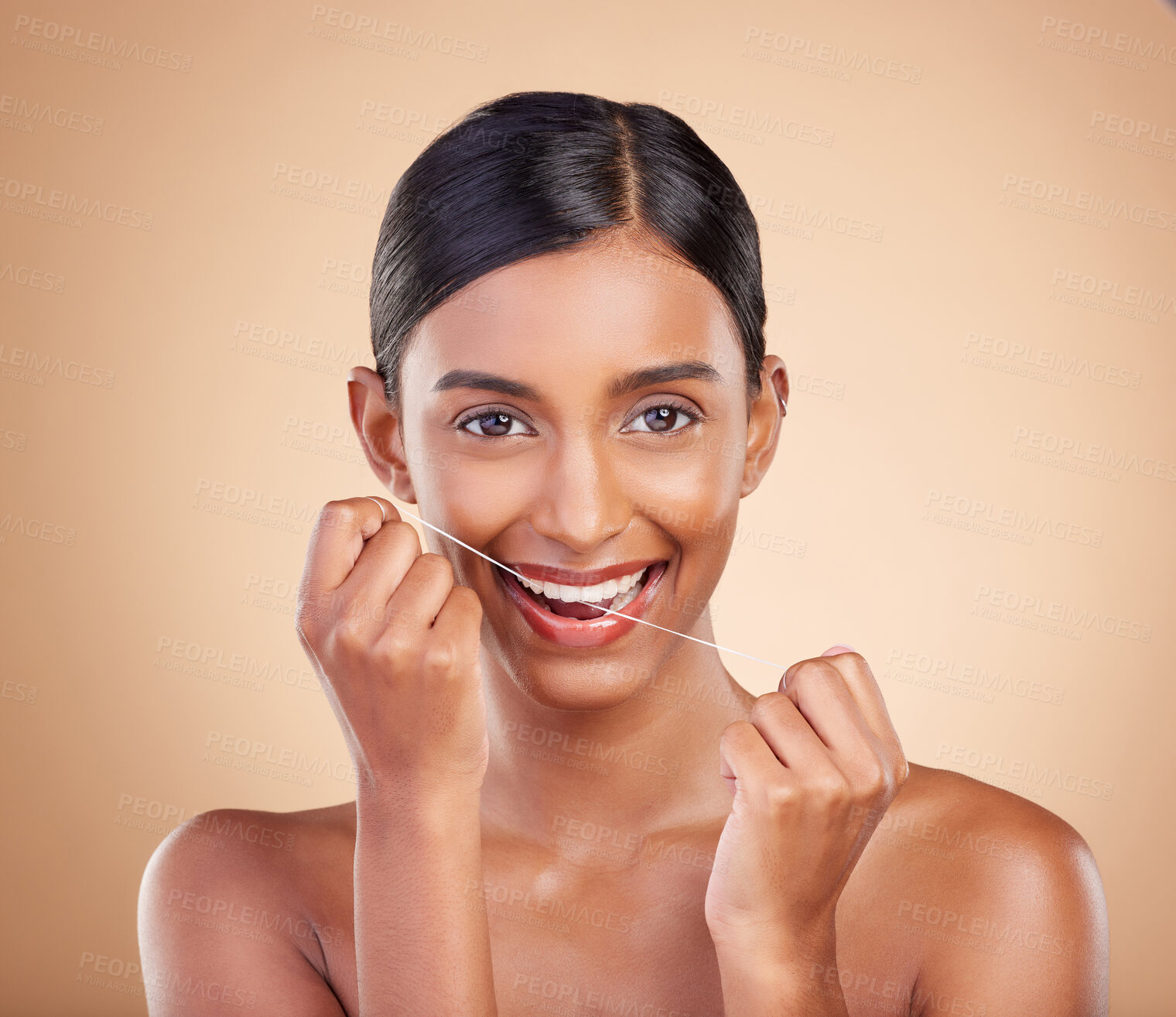 Buy stock photo Portrait, dental floss and cleaning with a model woman in studio on a beige background to promote oral hygiene. Face, mouth and teeth with an attractive young female posing for a dentist product