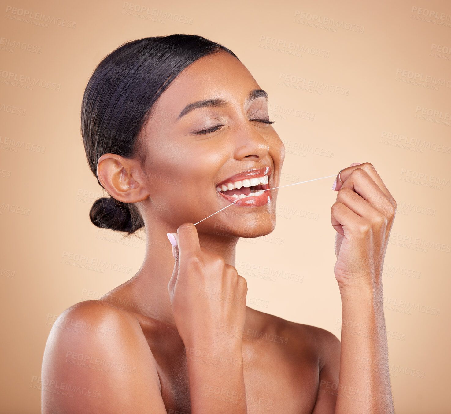 Buy stock photo Woman, teeth and flossing for dental care, dentist or healthcare and skincare against studio background. Happy female hands with floss for oral, mouth or gum hygiene for healthy clean tooth whitening