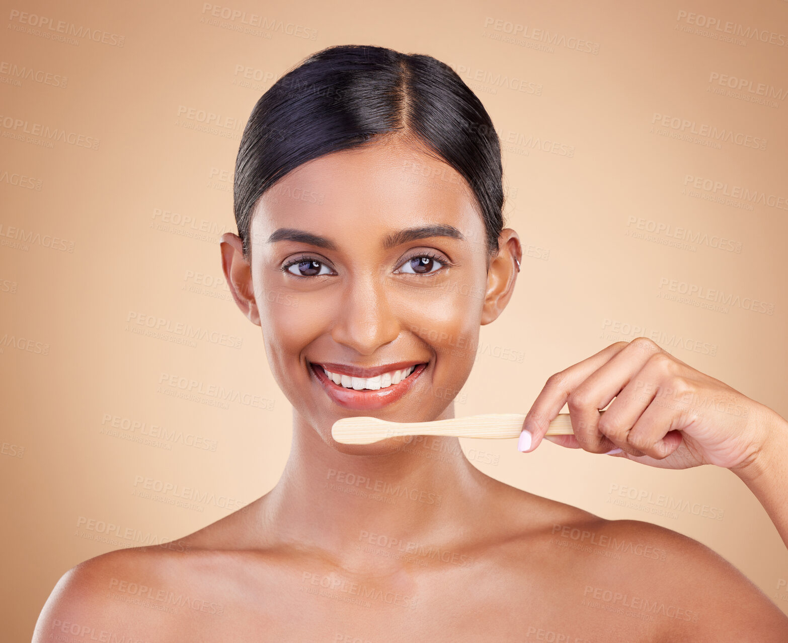 Buy stock photo Portrait, dental and toothbrush with a model woman in studio on a beige background to promote oral hygiene. Face, mouth and dentist up with an attractive young female cleaning or brushing her teeth