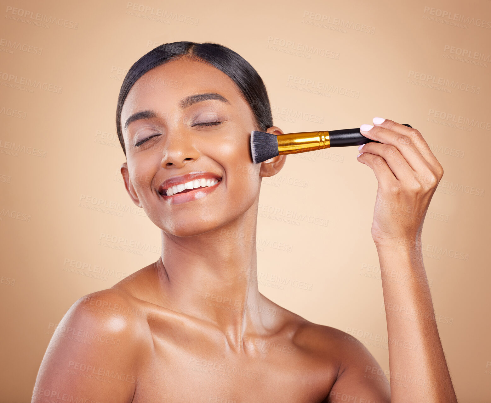 Buy stock photo Happy woman, brush or makeup artist with beauty, cosmetic products or self care on studio background. Eyes closed, model face or young Indian girl with cosmetics, glowing skincare or facial smile