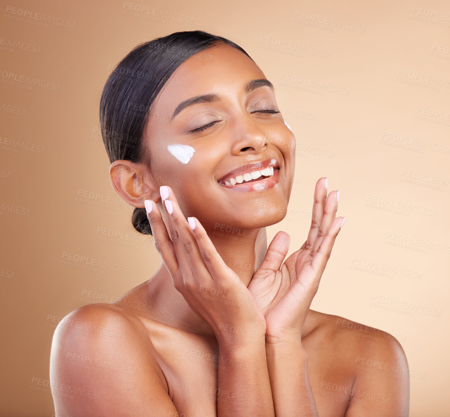 Buy stock photo Woman, face and skincare moisturizer cream for beauty cosmetics or self care against studio background. Happy female model smile applying lotion, creme or product in satisfaction for cosmetic facial