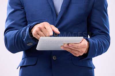 Buy stock photo Man, tablet in hands and online in studio for communication with network connection on social media. Hand of business male typing for internet search, mobile app and chat with contact for marketing