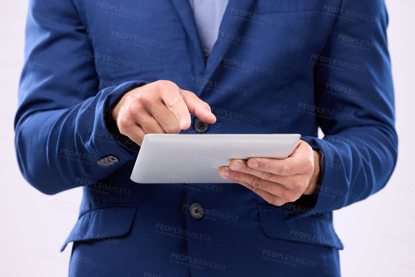 Buy stock photo Man, tablet in hands and online in studio for communication with network connection on social media. Hand of business male typing for internet search, mobile app and chat with contact for marketing