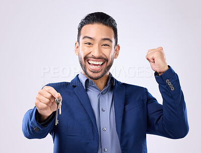 Buy stock photo Realtor man, keys and studio portrait for celebration, fist hands or smile for new home, property or background. Happy asian businessman, real estate entrepreneur excited for buying of building