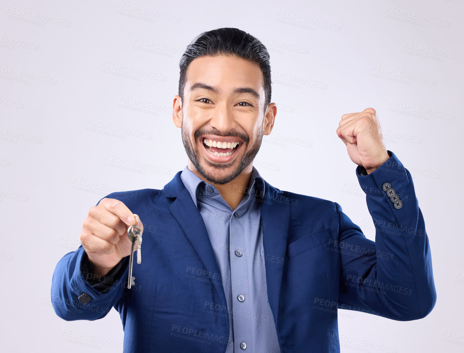 Buy stock photo Realtor man, keys and studio portrait for celebration, fist hands or smile for new home, property or background. Happy asian businessman, real estate entrepreneur excited for buying of building