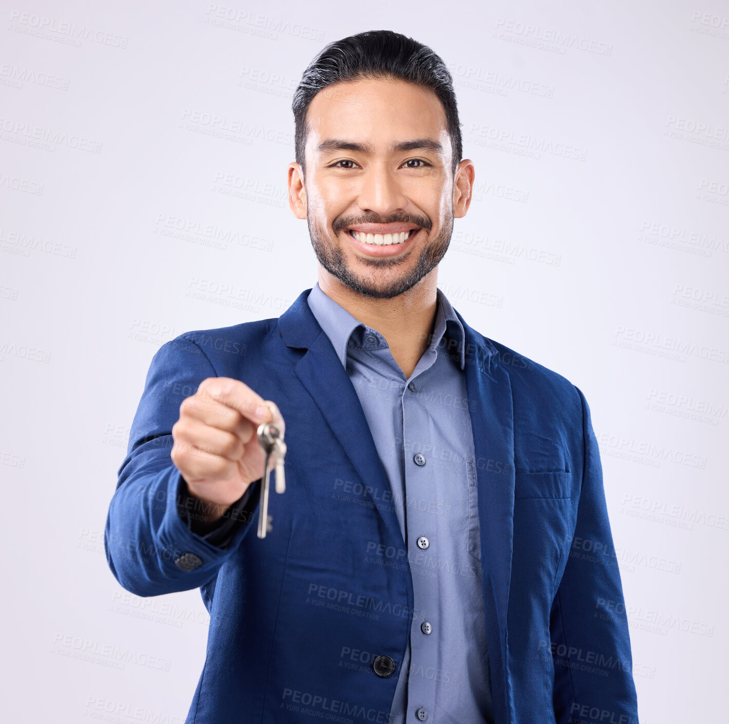 Buy stock photo Realtor man, keys and studio portrait with smile, dream and excited face for new home, house or property on background. Happy asian businessman and real estate agent for professional buying