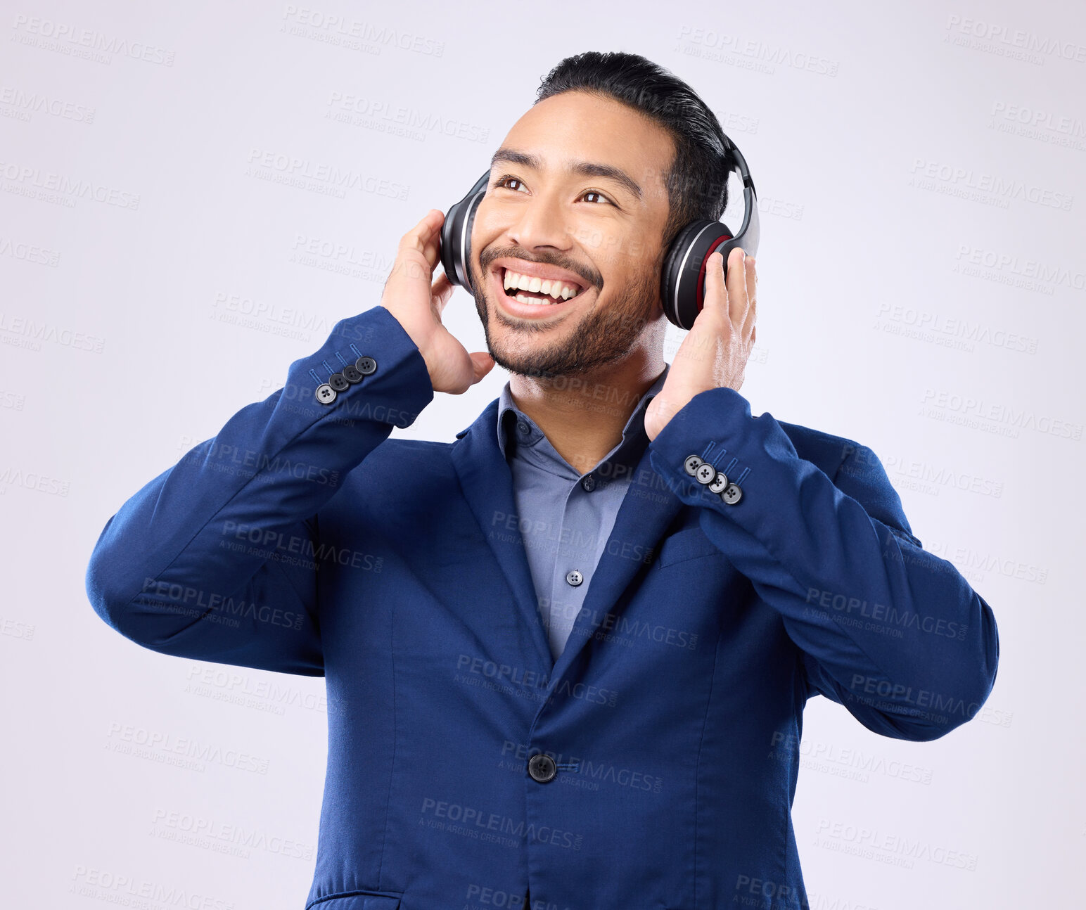 Buy stock photo Executive man, music headphones and thinking on studio background of happiness, motivation and inspiration. Happy corporate worker listening to audio, sound and business podcast on radio with smile 