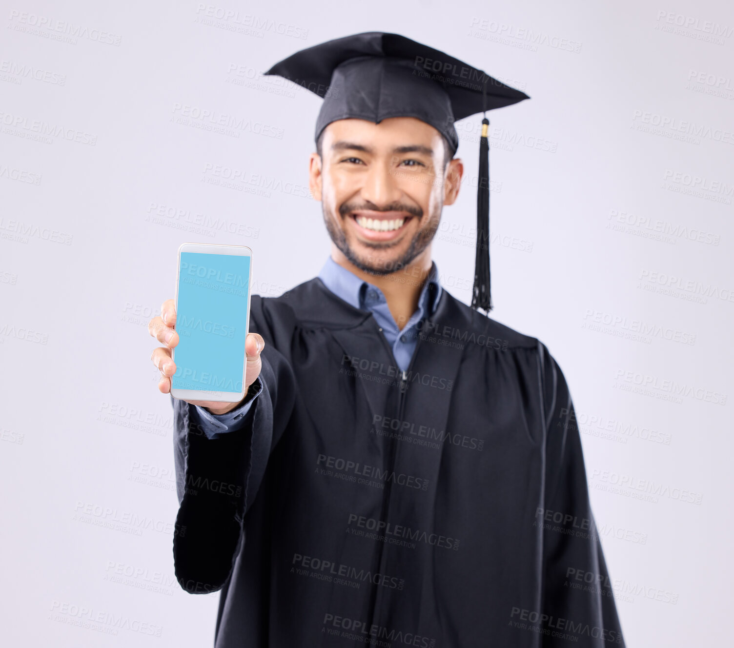 Buy stock photo Phone, green screen and graduation student portrait isolated on white background on cellphone mockup for university. Asian man or mobile app, elearning platform or success promotion in studio