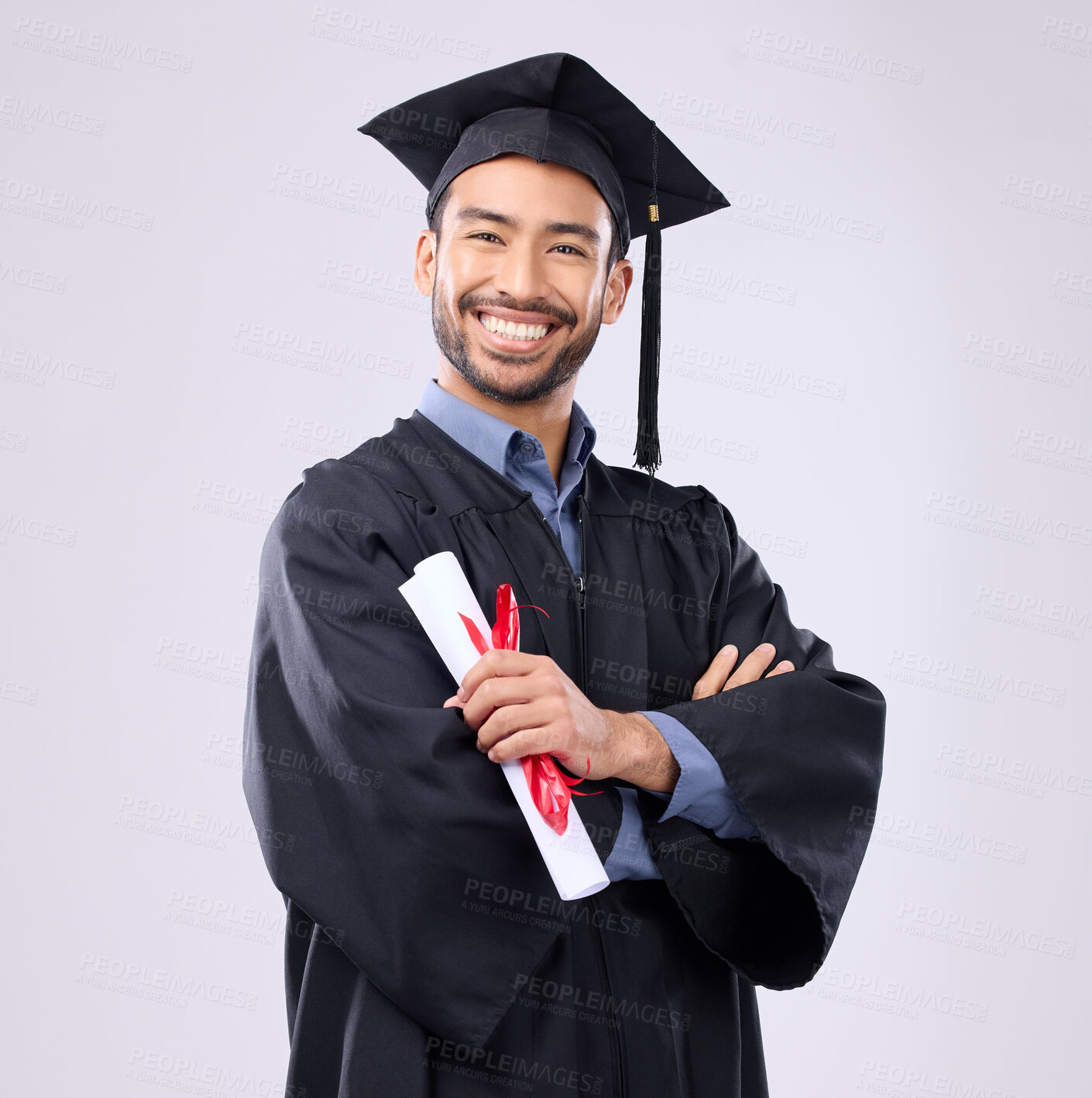 Buy stock photo Graduation man, diploma and arms crossed in studio portrait with smile, success and pride for achievement. College graduate, asian student and certificate with goals, motivation and excited for award