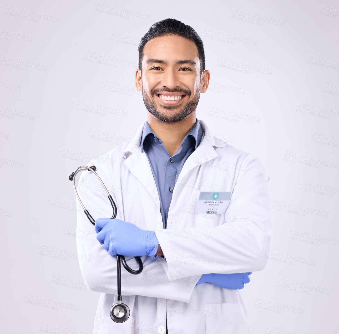 Buy stock photo Portrait, Asian man and doctor with stethoscope, success and motivation against grey studio background. Face, employee and medical professional with happiness, healthcare and consultant with wellness