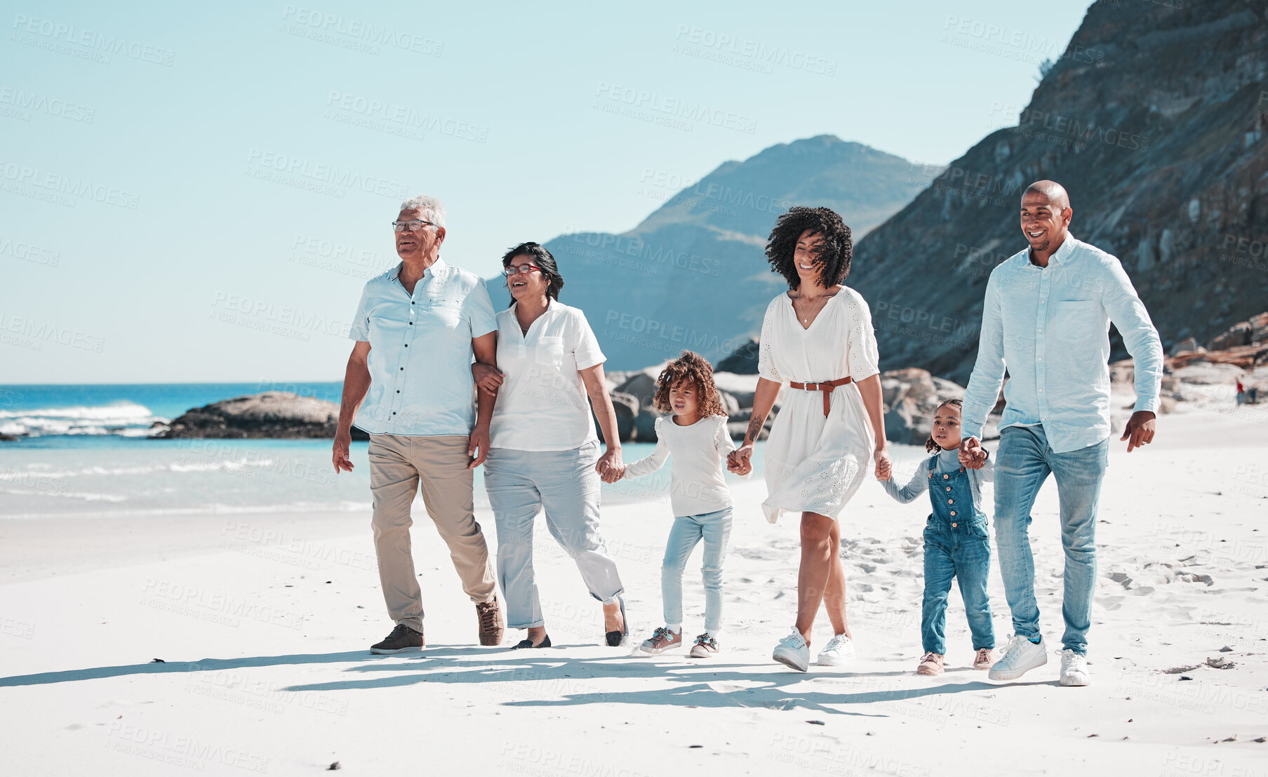 Buy stock photo Beach, grandparents and children walking with parents to relax on summer holiday, vacation and weekend. Happy family, travel and mother, dad and kids holding hands for fun, bonding and quality time