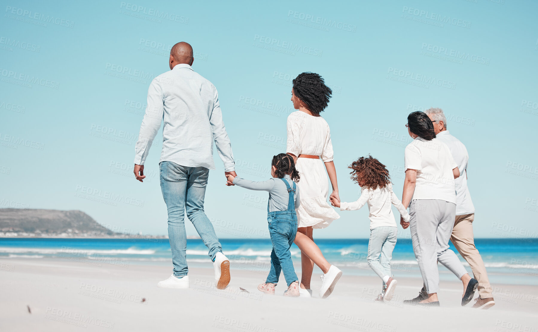 Buy stock photo Family, grandparents and children walking on beach to relax on summer holiday, vacation and weekend. Happy, parents and back of mother, dad and kids holding hands for calm, bonding and quality time