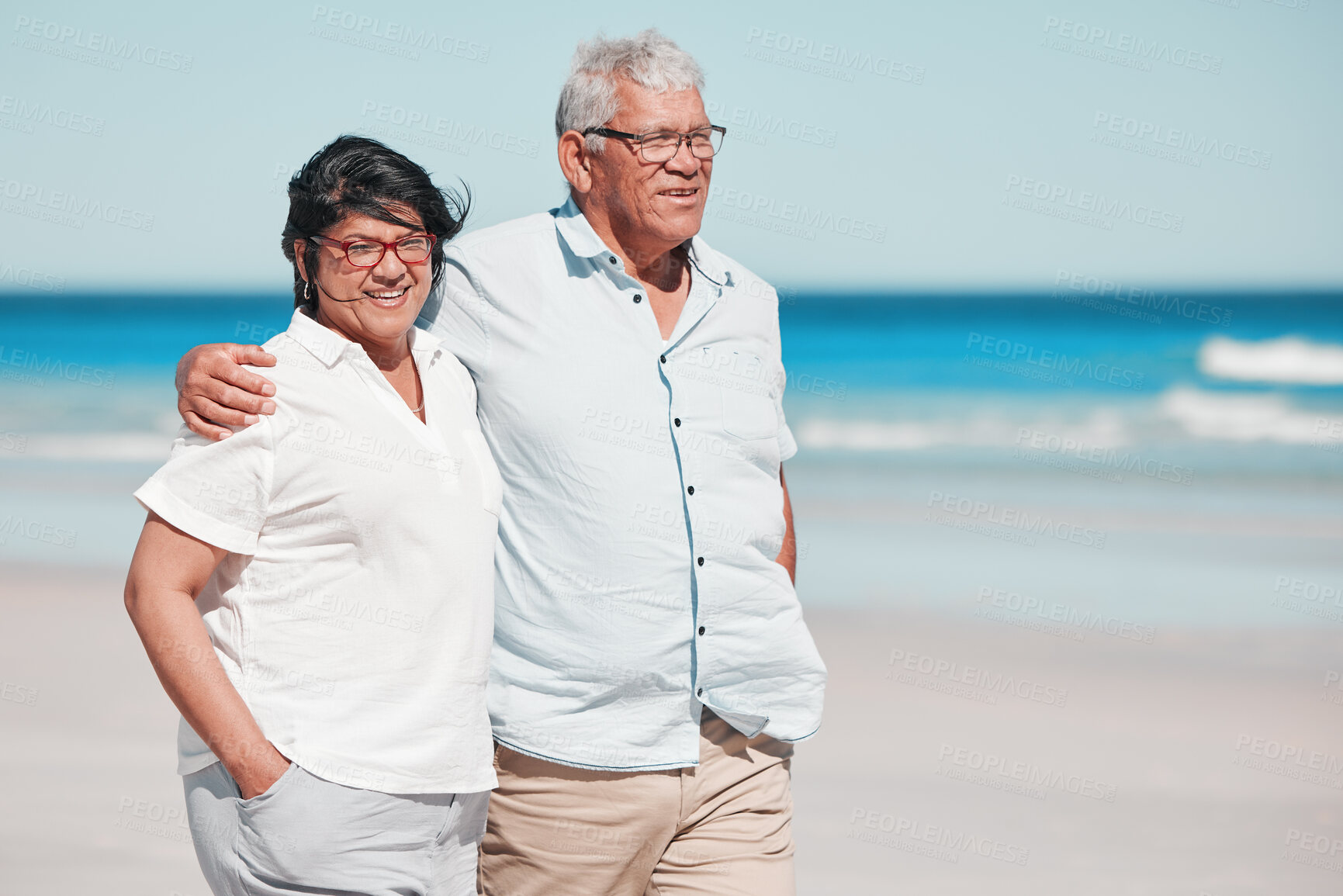 Buy stock photo Senior couple walking on beach for love, care and relax on summer holiday in nature, sunshine or trust. Happy retirement, man and woman walk at sea, happiness and travel with partner, smile and ocean