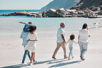 Grandparents, parents and children on beach walking to relax on summer holiday, vacation and weekend. Nature, travel and back of big family holding hands for bonding, quality time and calm by ocean