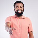 Portrait, success and black man with handshake, greeting and happiness against studio background. Face, African American male employee and entrepreneur with gesture for welcome, smile and trust