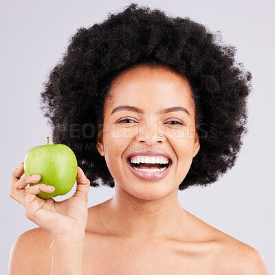 Buy stock photo Portrait, health and black woman with apple, diet and happiness against a grey studio background. Face, African American female and lady with fruit, wellness and healthy lifestyle with smile and joy