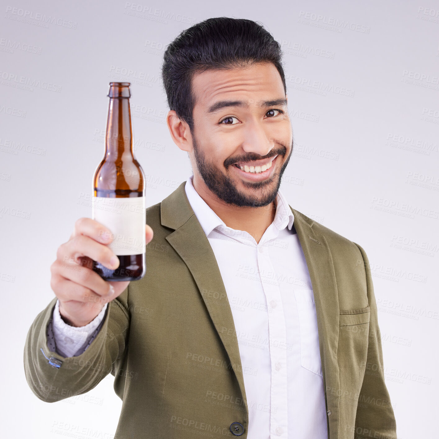 Buy stock photo Portrait of happy man with beer bottle isolated on a white background for alcohol product promotion and cheers. Professional Asian person or model face and hand holding wine glass container in studio